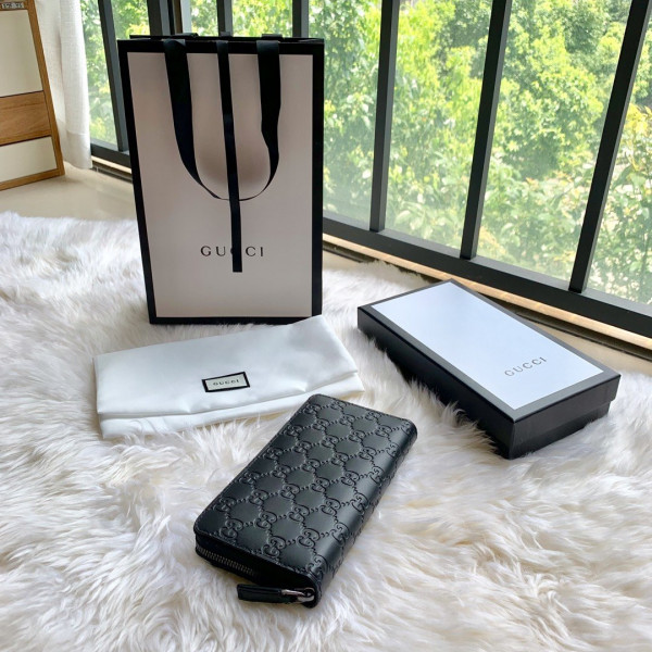 G*u*i leather zip around wallet