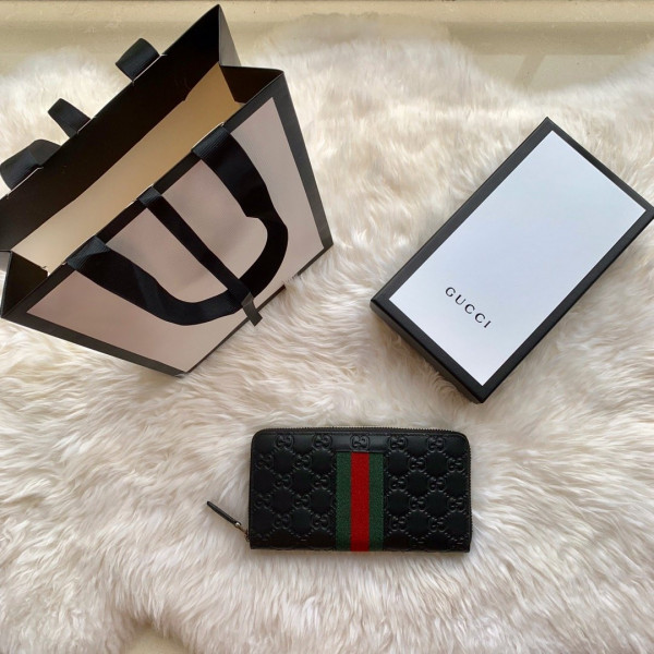 G*u*i leather zip around wallet