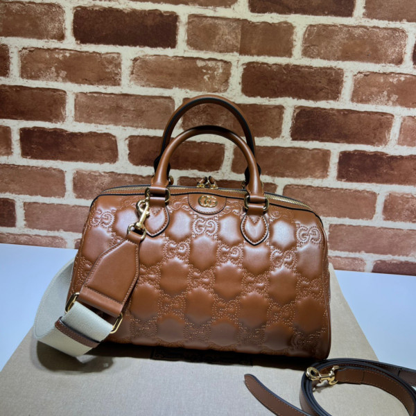 G*u*i gg matelassé leather top handle bag